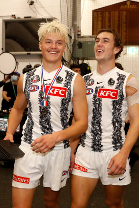 Jack Ginnivan and Callum Brown celebrate their side’s Anzac Day win.