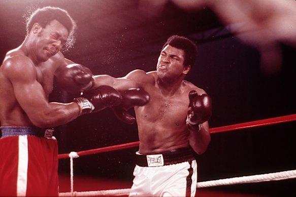 George Foreman takes a punch from Muhammad Ali in Zaire in 1974.