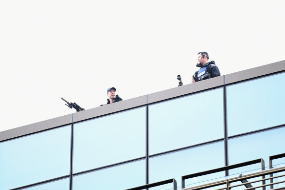 Armed police officers are seen on the roof of Christchurch High Court prior to the sentencing hearing of Brenton Tarrant.