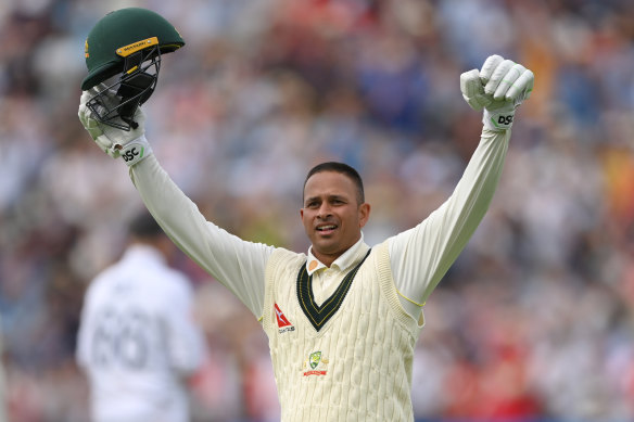 Usman Khawaja celebrates his century.