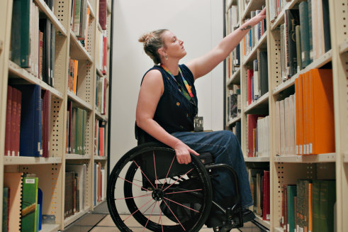 Shae Graham working as a library officer at the Melbourne Museum.