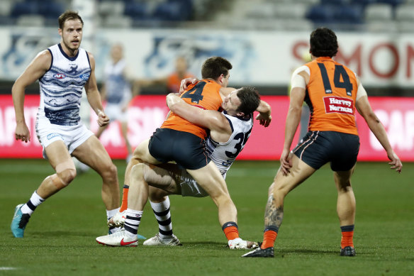 Toby Greene tries to fend off Patrick Dangerfield.