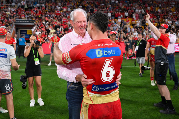 Wayne Bennett and Sean O’Sullivan celebrate the Dolphins’ big win against the Broncos.