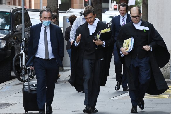 Arthur Moses, SC, (centre) the barrister for Ben Roberts-Smith arrives at the Federal Court.