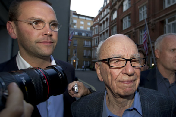 Rupert Murdoch and his son James Murdoch arrive at his residence in central London during the phone hacking inquiry.