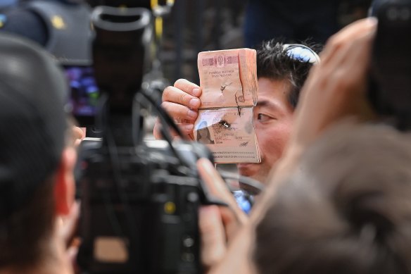 The damaged Russian passport of Yekaterina Volkova, who was rescued from the bombed apartment building, was shown to media.