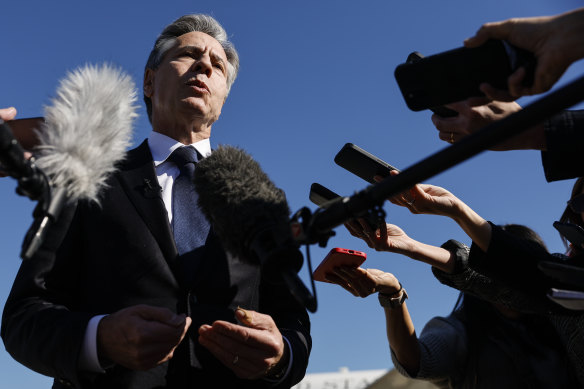 US Secretary of State Antony Blinken talks to reporters prior to boarding.