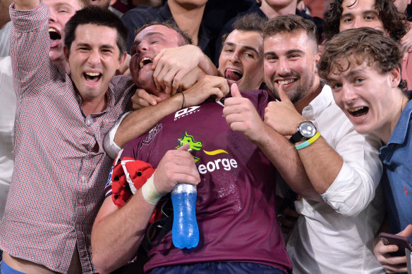 Jubilant home fans celebrates with the Reds' Harry Wilson on Saturday night.