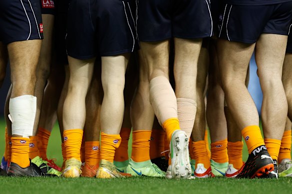Blues players wear orange socks as part of the Carlton Respects campaign for the 2021 season.