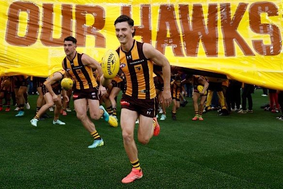 Connor Macdonald of the Hawks runs out.