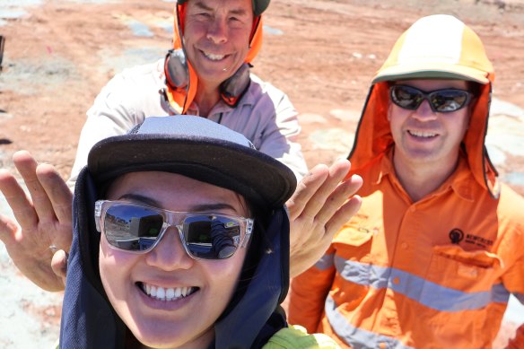 Auric Mining finance manager and joint company secretary Catherine Yeo, senior geologist Nicholas Snow and technical director John Utley (back) are all smiles during grade control drilling at the company’s Munda gold deposit.