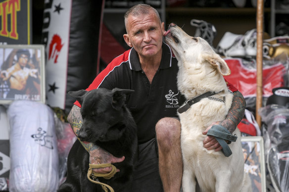 Former prison officer Paul O'Sullivan with  German Shepherds Gypsy (left) and Sultan (right).