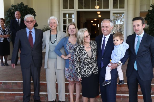 Then-prime minister Malcolm Turnbull with his grandson Jack, wife Lucy and his daughter Daisy, son-in-law James Brown, and parents-in-law Tom and Christine Hughes at Government House, 2015.