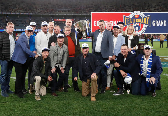 Carey with ex-teammates from North Melbourne’s 1996 premiership team at Marvel Stadium this season.