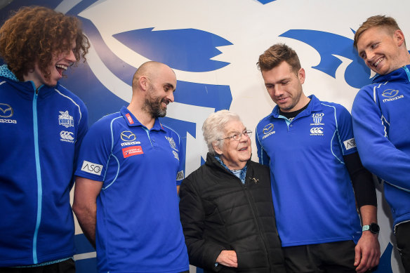 The Kangaroos return the support of longtime fan Dorothy Forth, who was the victim of a home invasion.  Ben Brown, coach Rhyce Shaw, Shaun Higgins and Jack Ziebell were at the presentation.