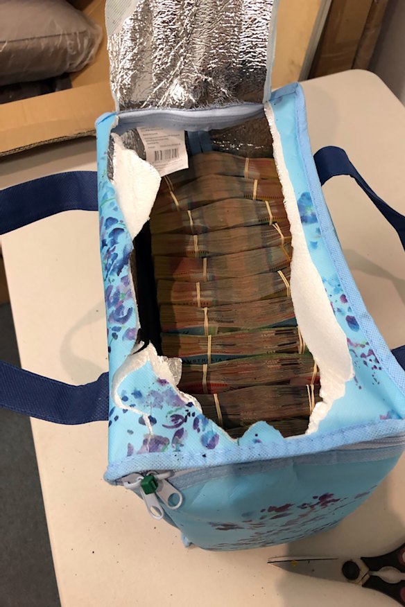 Wuchen Wang was arrested clutching two bags each containing $500,000