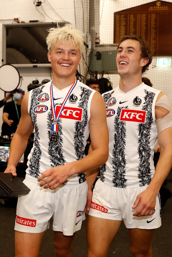 Jack Ginnivan and Callum Brown celebrate their side’s Anzac Day win.