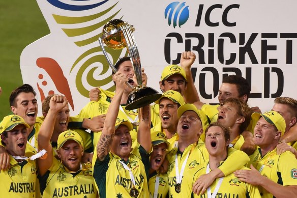 Home heroes: Michael Clarke holds up the 2015 trophy after Australia beat New Zealand in the World Cup final at the MCG