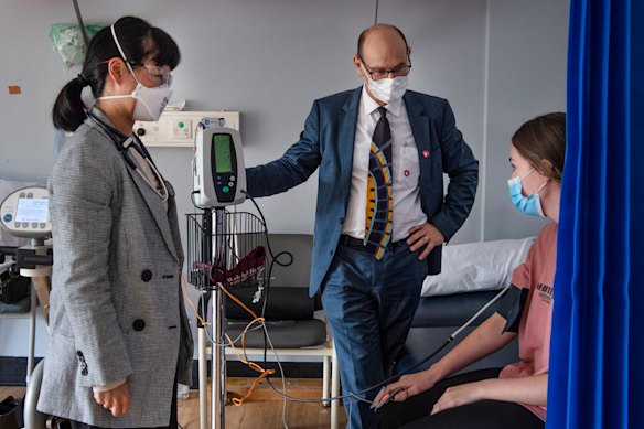 Doctors meet with a patient at the long COVID clinic in St Vincent’s Hospital in Sydney.