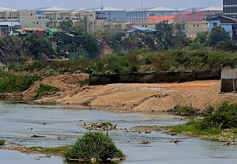 KK Park in Myanmar, known for its scam compounds, is seen across the Moei River on the Myanmar–Thailand border.