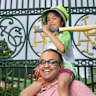 Nikhil Kulkarni with his daughter Neeti, 6, at the gates to SCG. He is teaching his daughter how to play and sharing his love of the game.