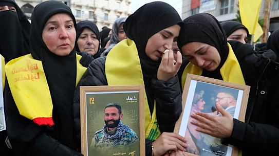 Mourners react during the funeral procession in Bint Jbeil, South Lebanon.