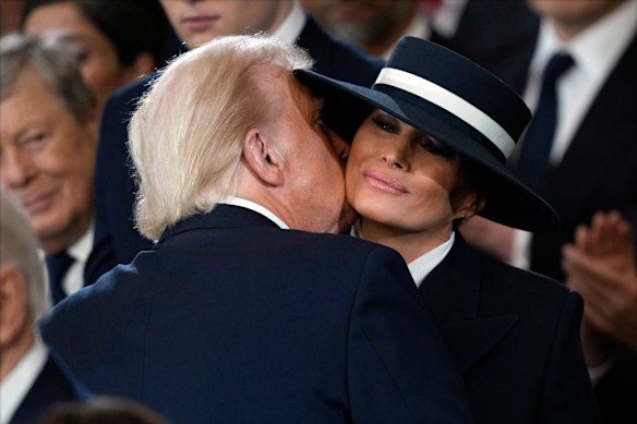 Second time round: Trump kisses Melania during his inauguration in January.