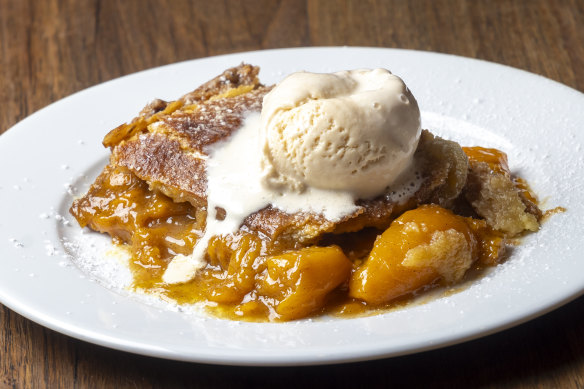 Peach cobbler with ice-cream.