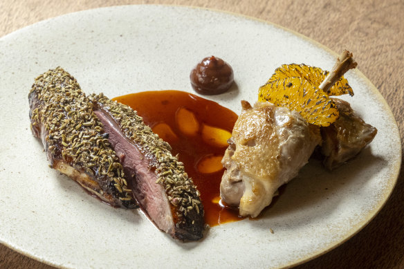 Duck breast, its skin crusted with fennel, is served with the confit leg in a Davison plum sauce with burnt orange.