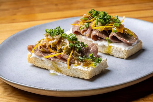 Ox tongue toasts with horseradish cream and gremolata.