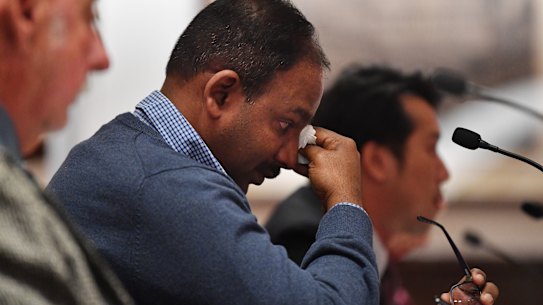An emotional Vijay Vital, apartment owners in Mascot Towers, wipes away tears after delivering his opening statement to the Legislative Council Public Accountability Committee.