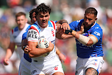 Herbie Farnworth tries to beat the French defence. 