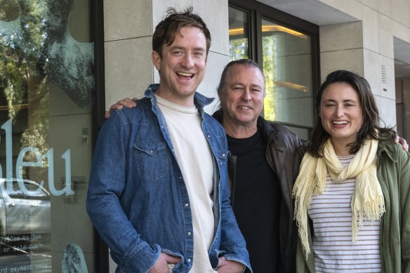 Mike and Mia Russell with Neil Perry (centre) outside their Sydney bakery.