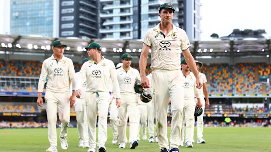 A frustrated Pat Cummins leads his team off at stumps.