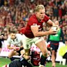 BRISBANE, AUSTRALIA - JULY 02: Duhan Van Der Merwe of the British & Irish Lions breaks free of the tackle and scores a try during the tour match between Queensland Reds and British & Irish Lions at Suncorp Stadium on July 02, 2025 in Brisbane, Australia. (Photo by Chris Hyde/Getty Images)