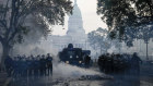Police clear the streets during clashes with anti-government protesters outside the Argentinian Congress in Buenos Aires.