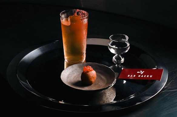 Sake cocktail with an ikura (salmon roe) doughnut.