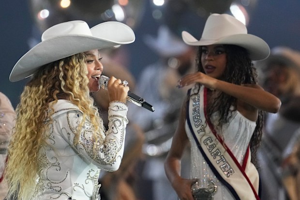 Beyoncé, left, performs alongside her daughter, Blue Ivy.