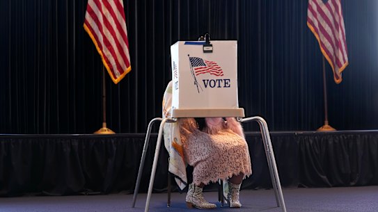 A voter works on her ballot at a polling place at the Ronald Reagan Presidential Library, Simi Valley, California