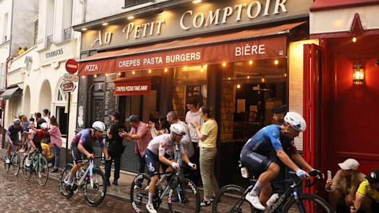 Hours before the peloton arrived, spectators had already filled the Paris neighborhood.