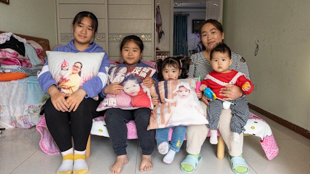 The Zhang sisters Yueying, Boran, Xinyu and Xinran with their mother, Xu Zhenzhen. “I’ve already told my children, ‘Don’t follow in your mum’s footsteps,’ ” says Xu.