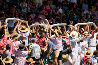 Fans enjoy the Sydney Test last year. Although numbers will be halved this year, it is still a risk.