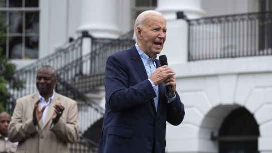 President Joe Biden speaks during a barbecue with active-duty military service members and their families on the South Lawn of the White House.