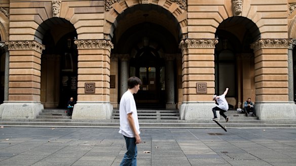 Skateboarders take advantage of a quiet Martin Place in Sydney's CBD during lunchtime. 