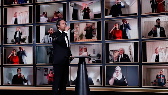 Cheers: Brownlow Medal presenter Hamish McLachlan and virtual attendees toast winner Lachie Neale during the 2020 Count at NEP Studios in Southbank, Melbourne.