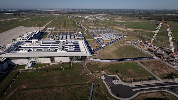 Western Sydney Airport’s terminal is a short walk to the site of the metro station where cranes operate.