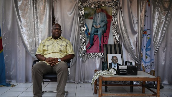 Felix Tshisekedi sits next to a memorial to his father, former Premier Etienne Tshisekedi, the founder of the UDPS party.