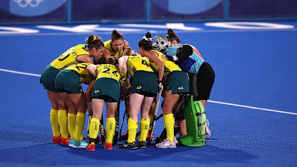 Australia players huddle on pitch during the Women’s Preliminary Pool B match between New Zealand and Australia.