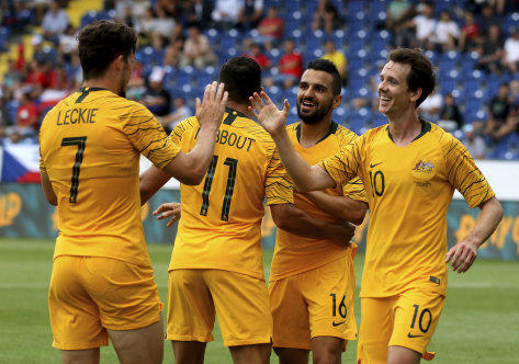 That's gold: Australia celebrate the opening goal against the Czech Republic.