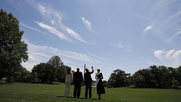 The first couples of the United States and Poland watch a flyover of one of two F-35 Joint Strike Fighter aircraft at the White House.